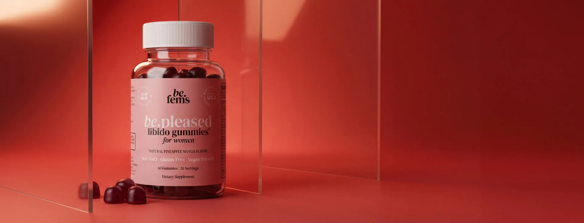 be.fems be.pleased libido gummies bottle on a red studio backdrop